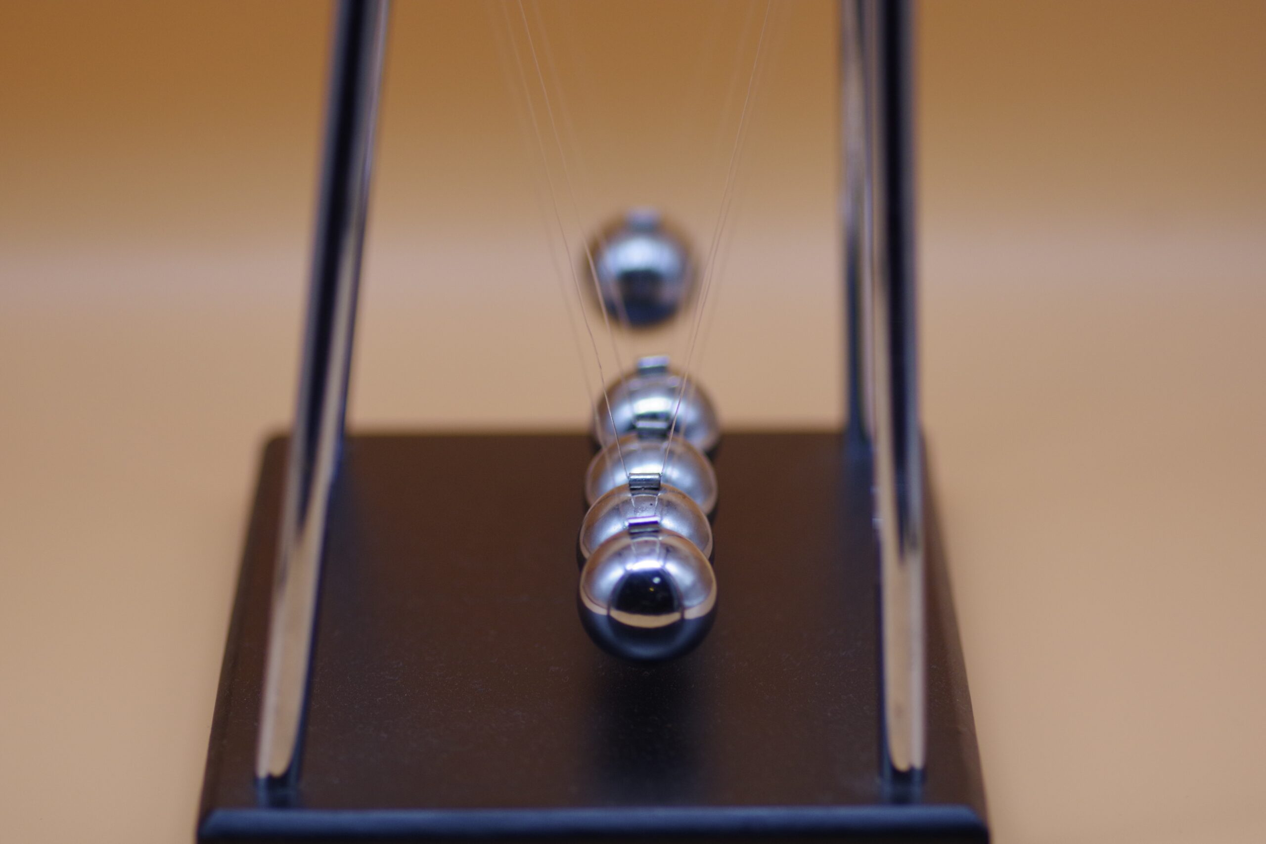 Newton's Cradle also illustrates cause and effect in strategy acceleration.